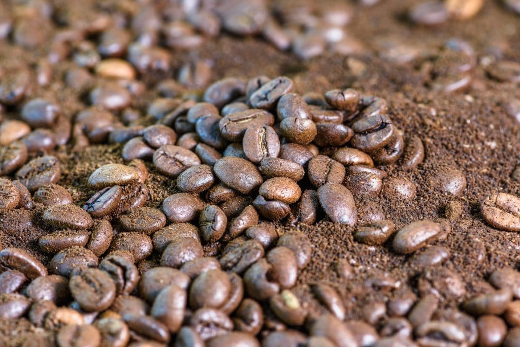 Ground coffee and whole beans mixed
